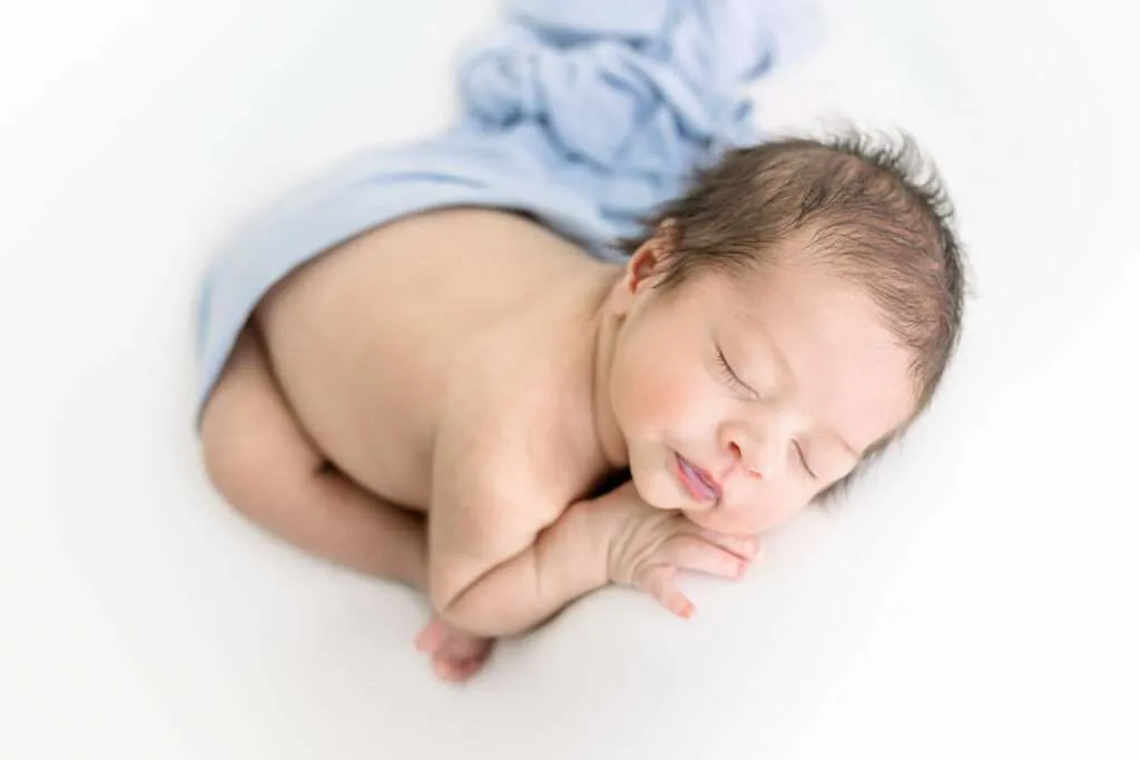 posed newborn boy for newborn photograph