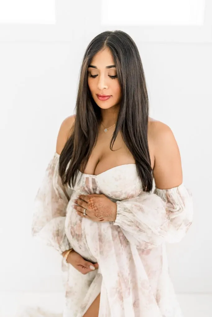 woman in maternity dress in studio