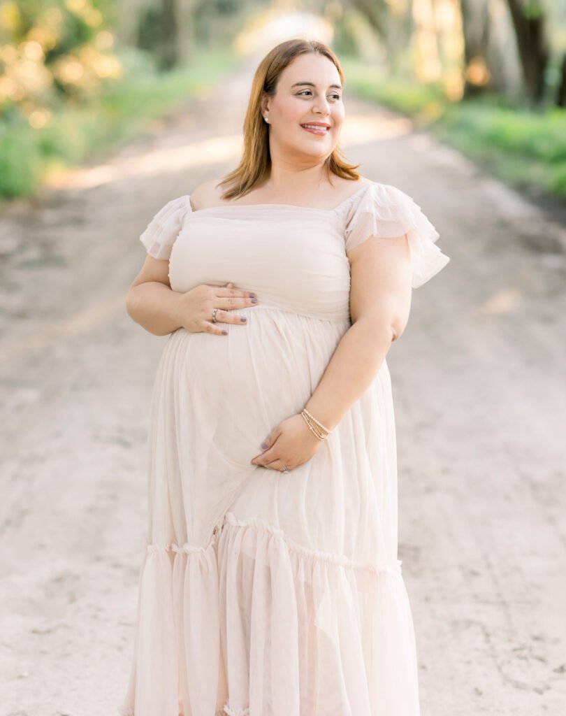 woman holding baby bump