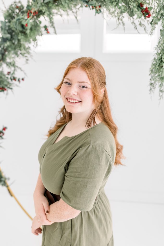 girl in green dress for christmas mini session