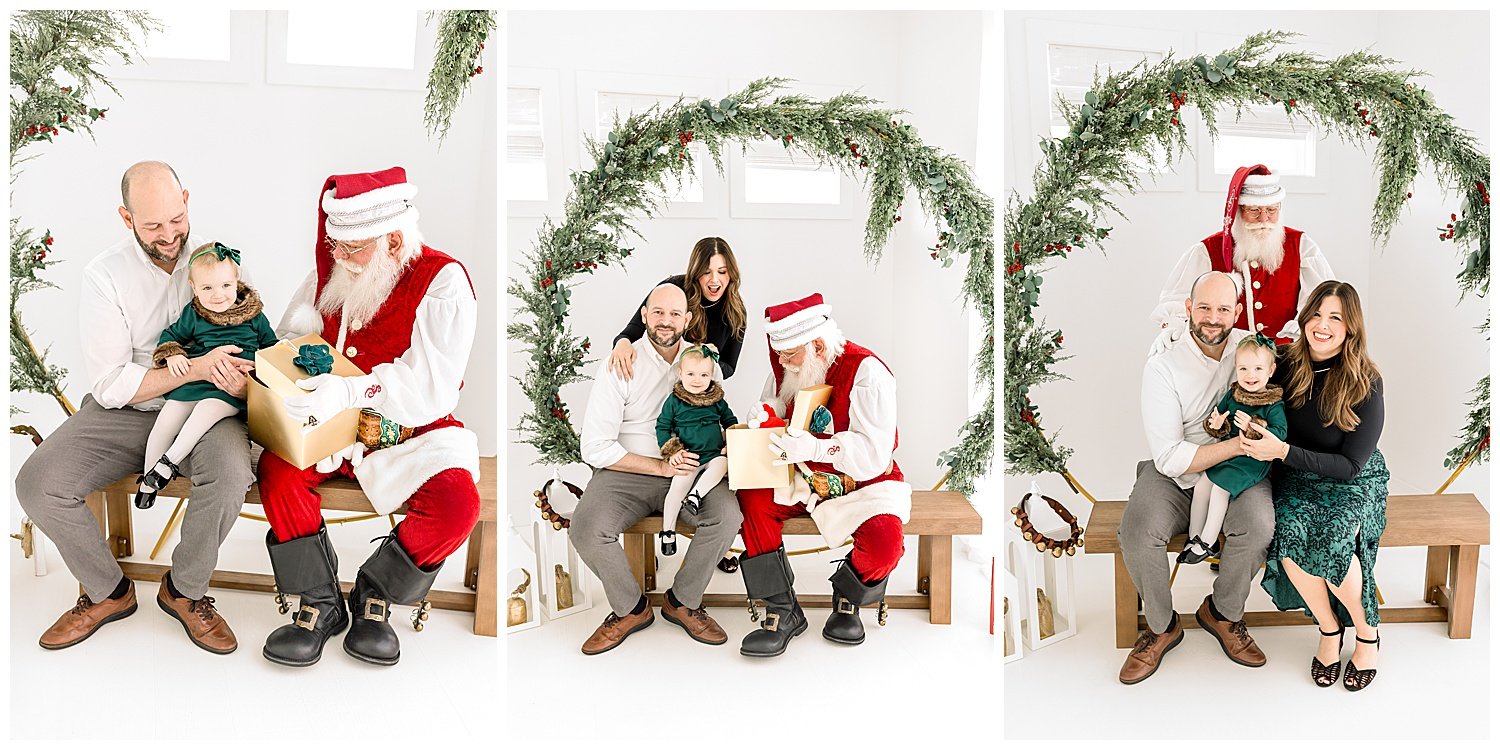 baby girl and family visiting santa