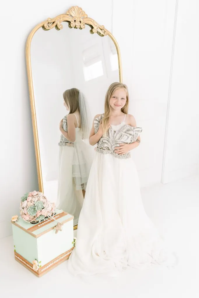 little girls photoshoot with moms wedding dress