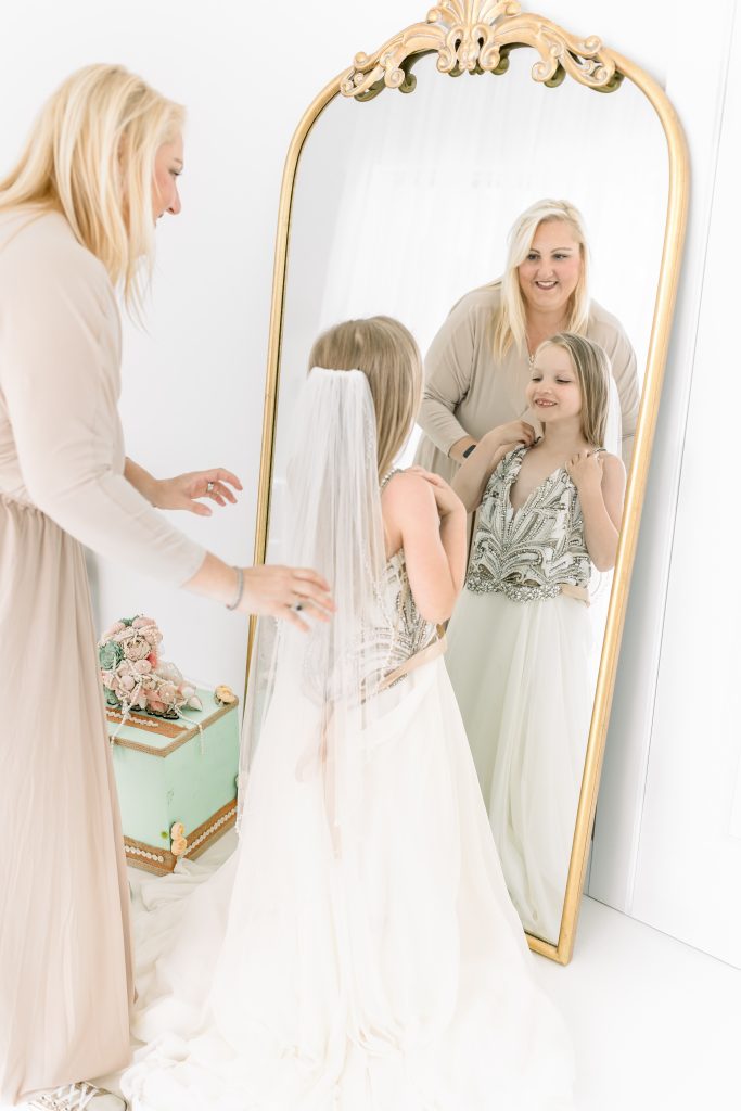 mom and daughter with wedding dress