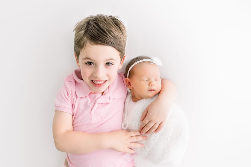 Bright and airy newborn photography studio in Wesley Chapel featuring white curtains and natural light for family portraits.